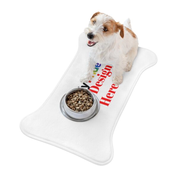 Dog food and water bowls sitting on a custom personalizable pet feeding mat that protects the floor from spills.