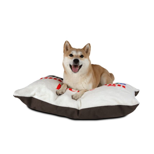 Dog lying on a custom personalizable pet bed with a soft cushion and raised sides.